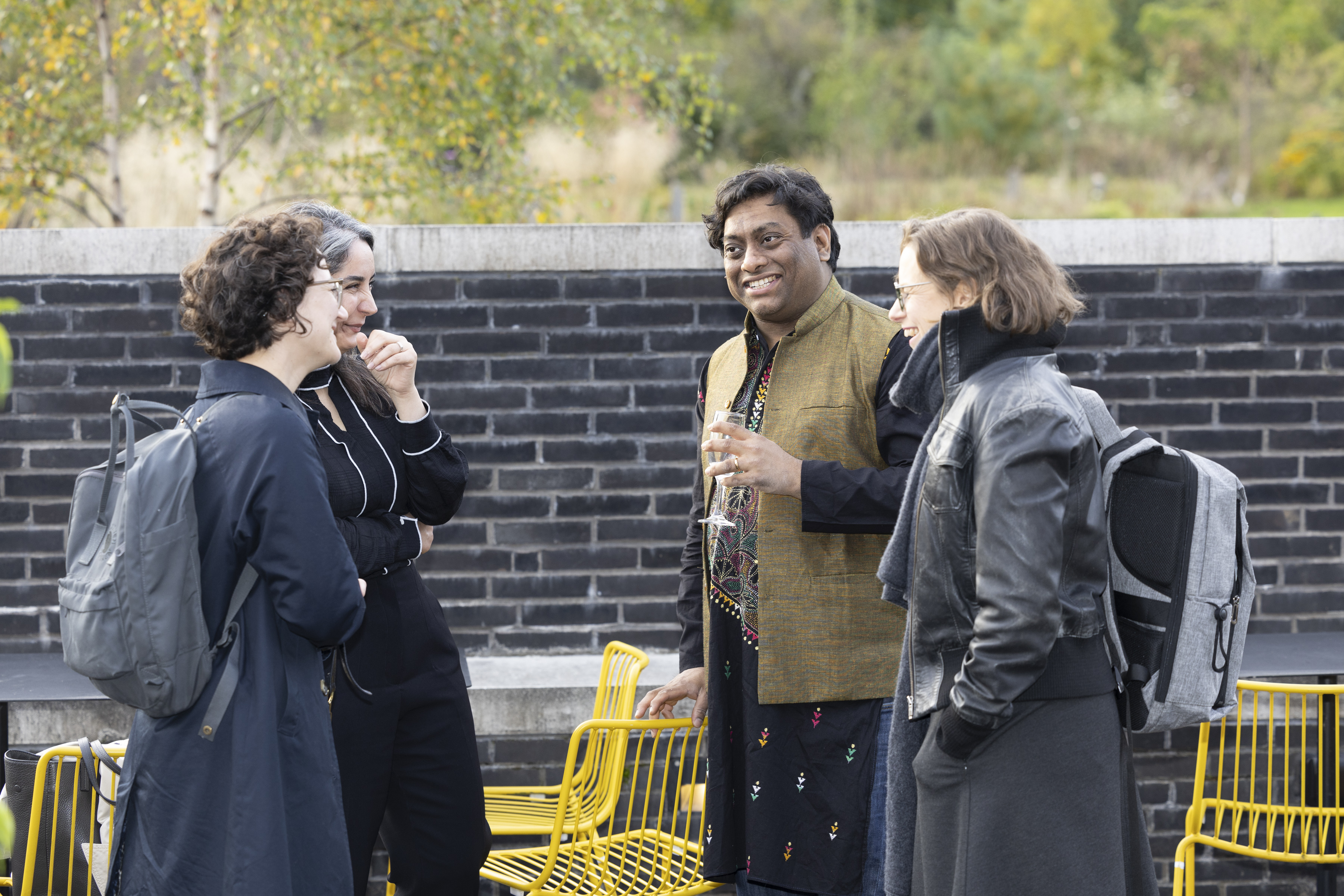 People smiling and laughing outside