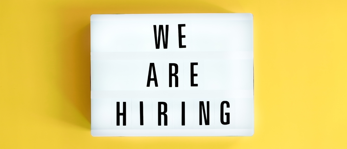 Lightbox with a words text We Are Hiring board on yellow background