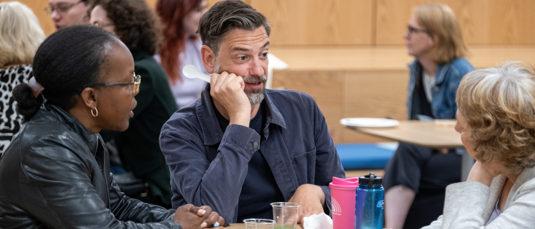 A group of people networking at an event