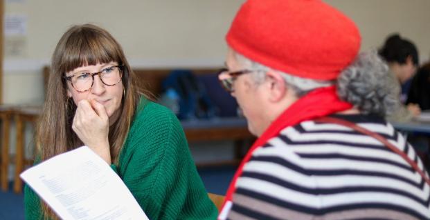 Two participants of a workshop having a conversation